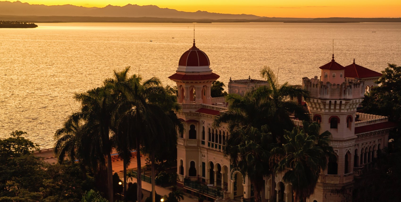 View of Cienfuegos along the water at sunset