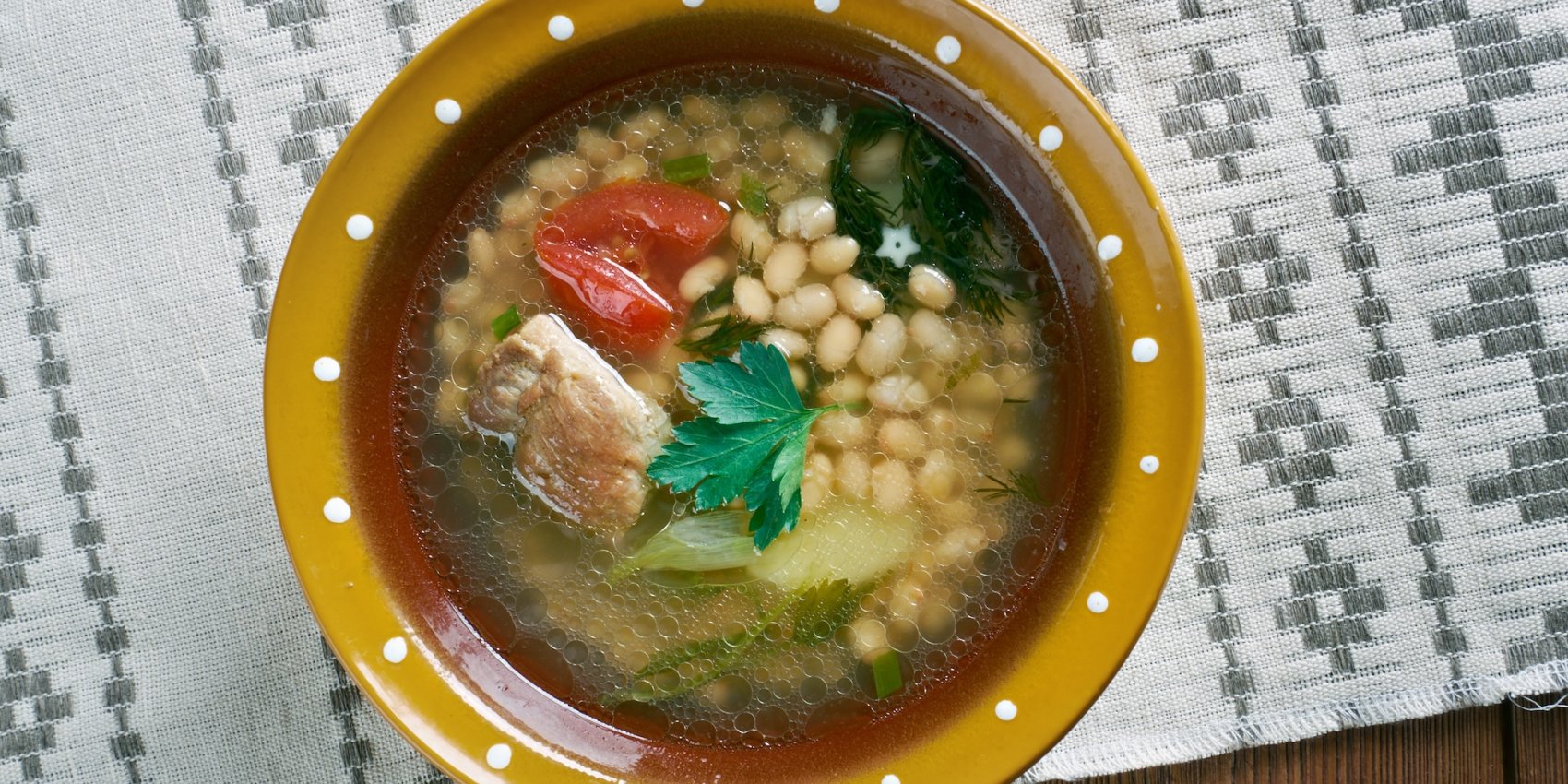 A bowl of white bean soup in Albanian, known as Jani me Fasule.