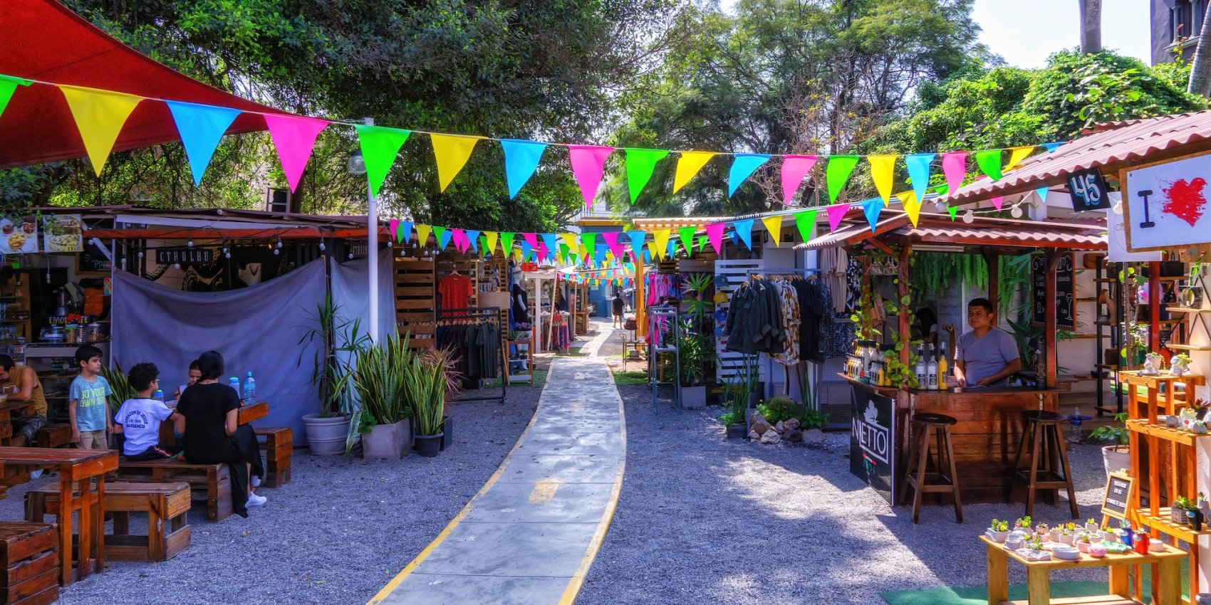 People enjoying a colorful marketplace in Barranco in Lima, Peru.