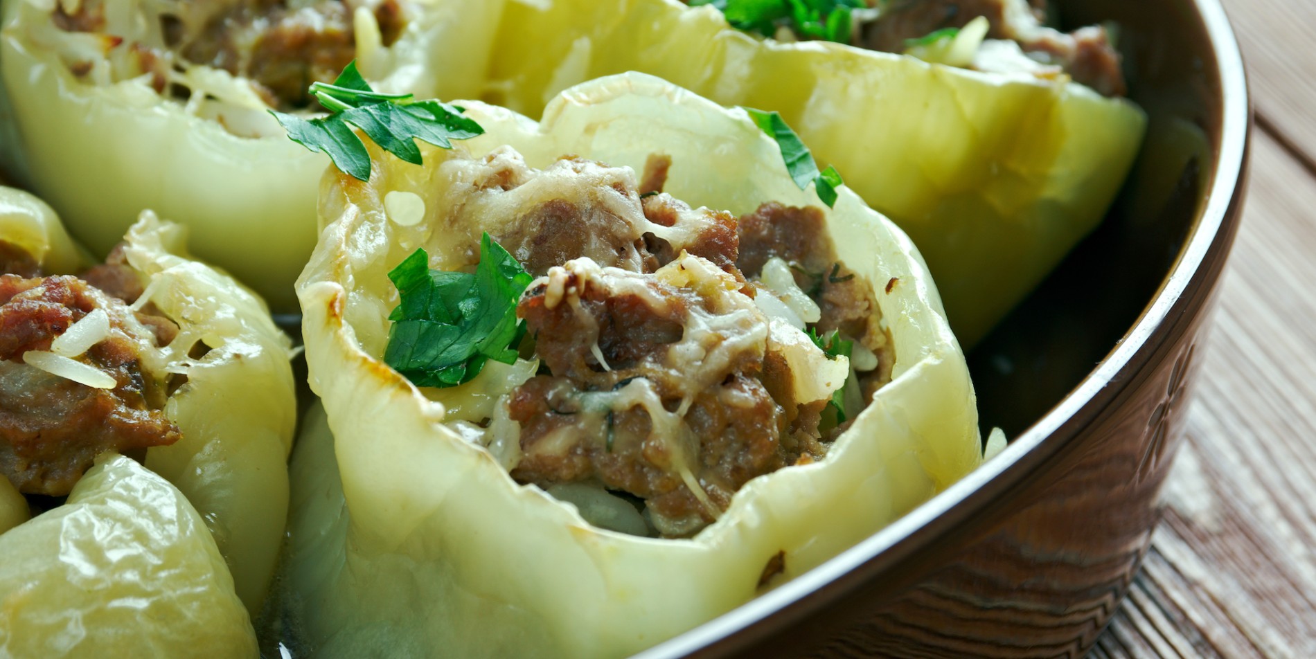 Traditional Croatian stuffed yellow peppers topped with paprika and cheese