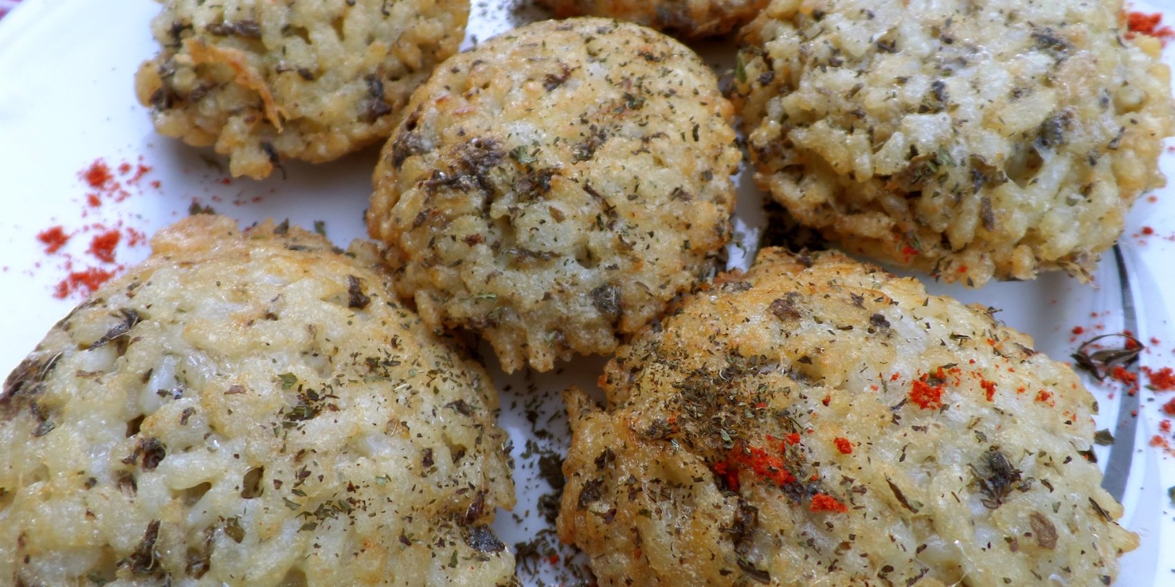 Multiple Albanian rice snacks, qifqi, plated and ready to be served.