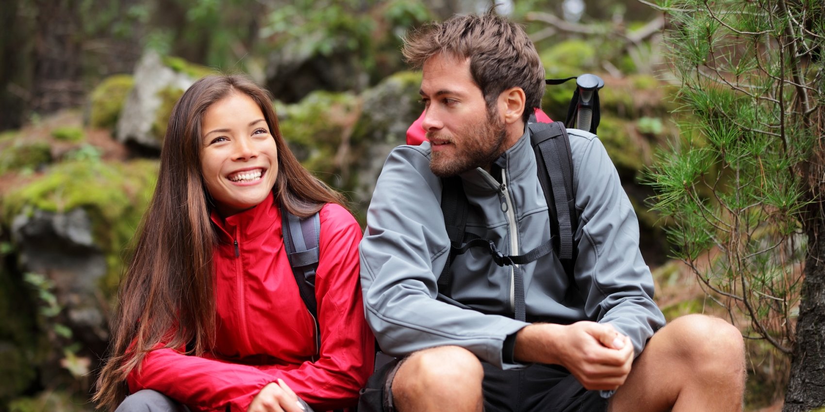 Two people taking a break while hiking.
