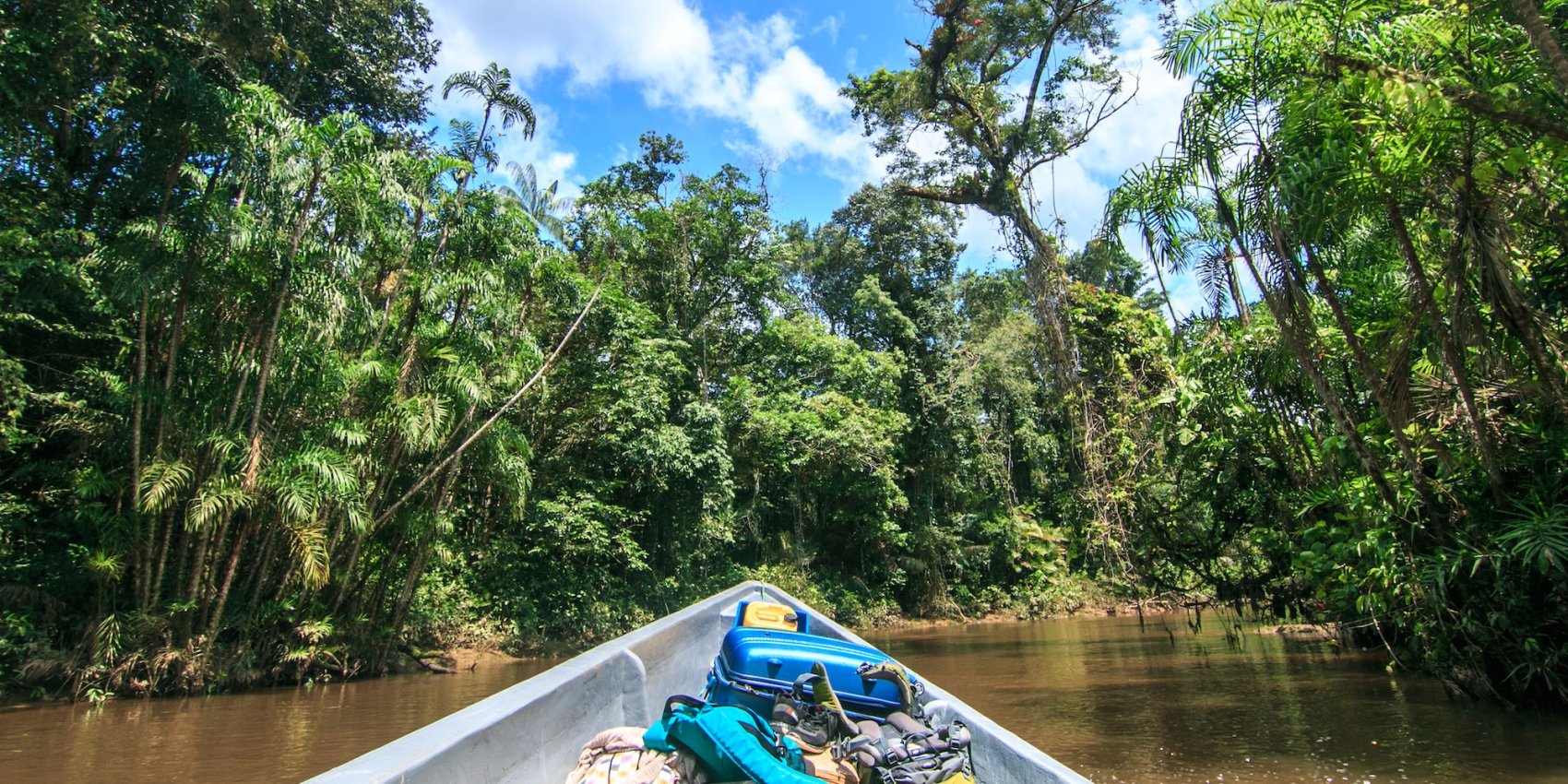 Canoe journey through a jungle river in the Amazon Basin – a unique adventure following a Galápagos trip.