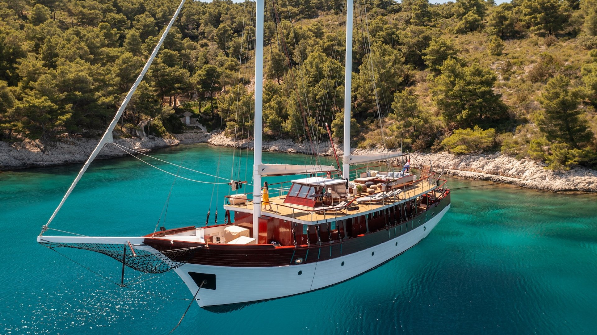 The Romantica yacht floating on calm blue waters in Croatia.