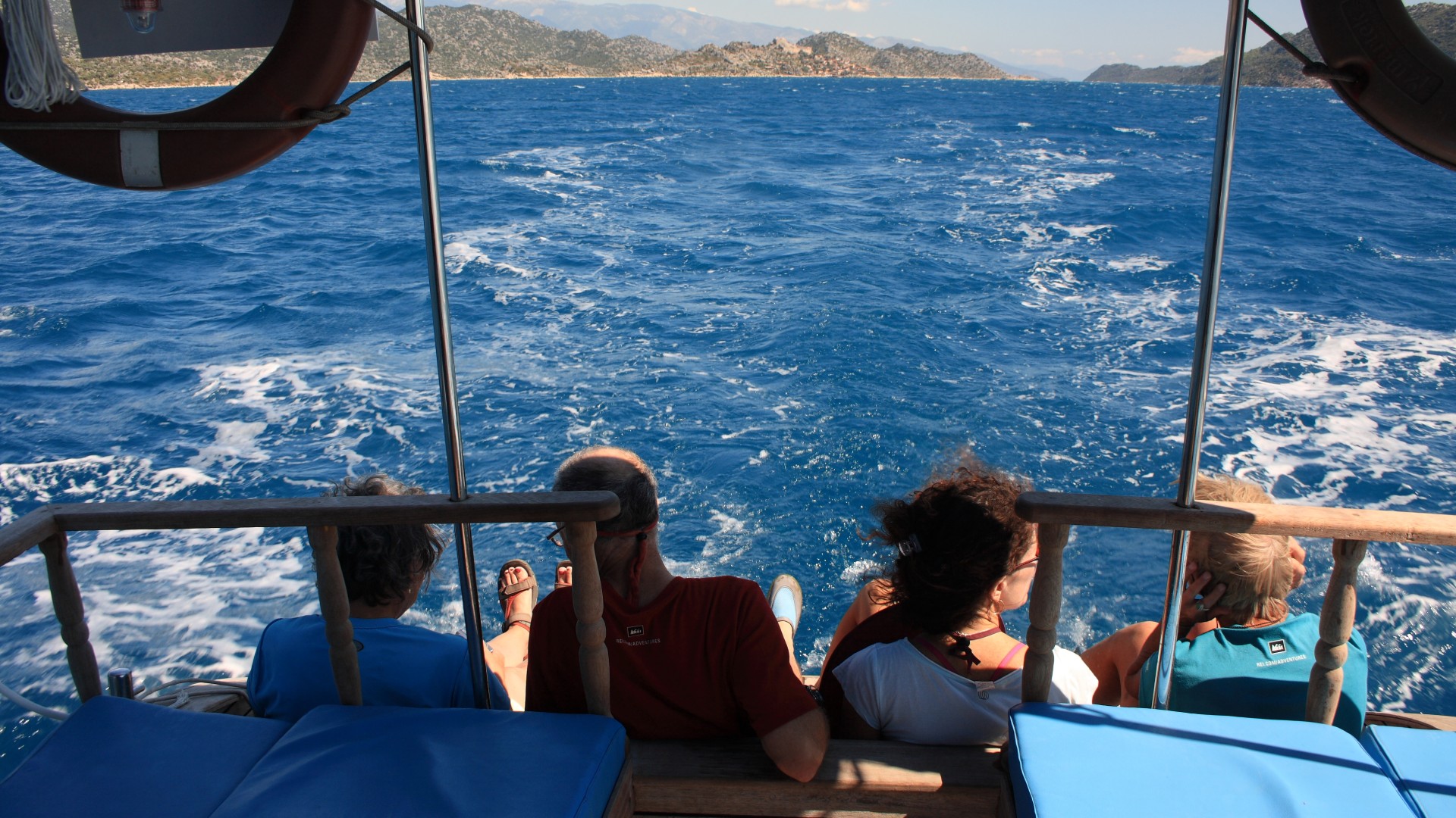 Guests aboard a small ship sailboat in Turkey enjoying the cruise
