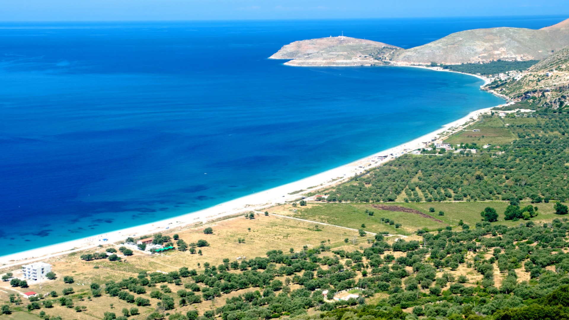 View of a vast stretch of coastline along the turquoise waters of Himara, Albania