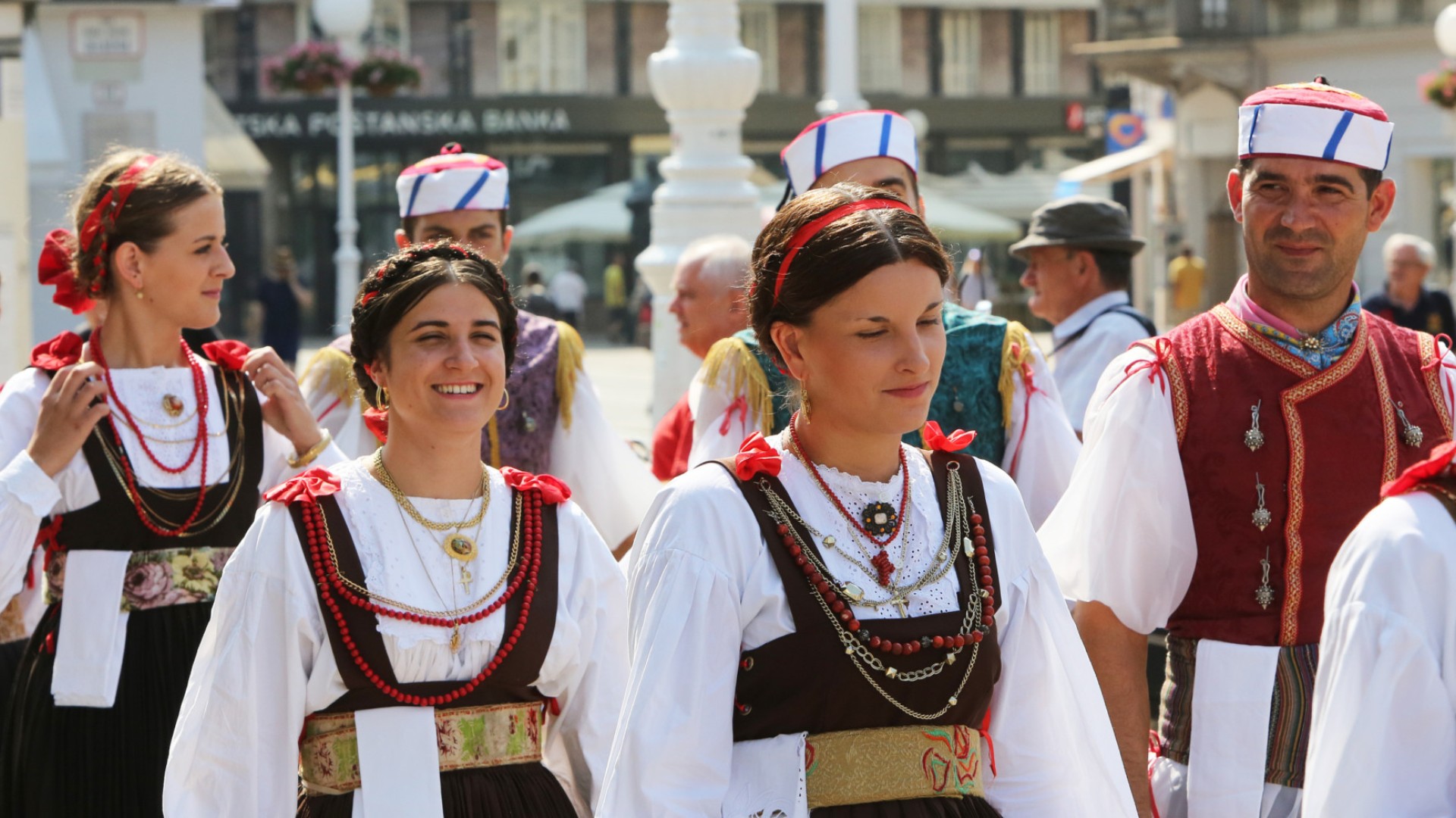 Local Croatians dressed in traditional clothing in the streets of Croatia