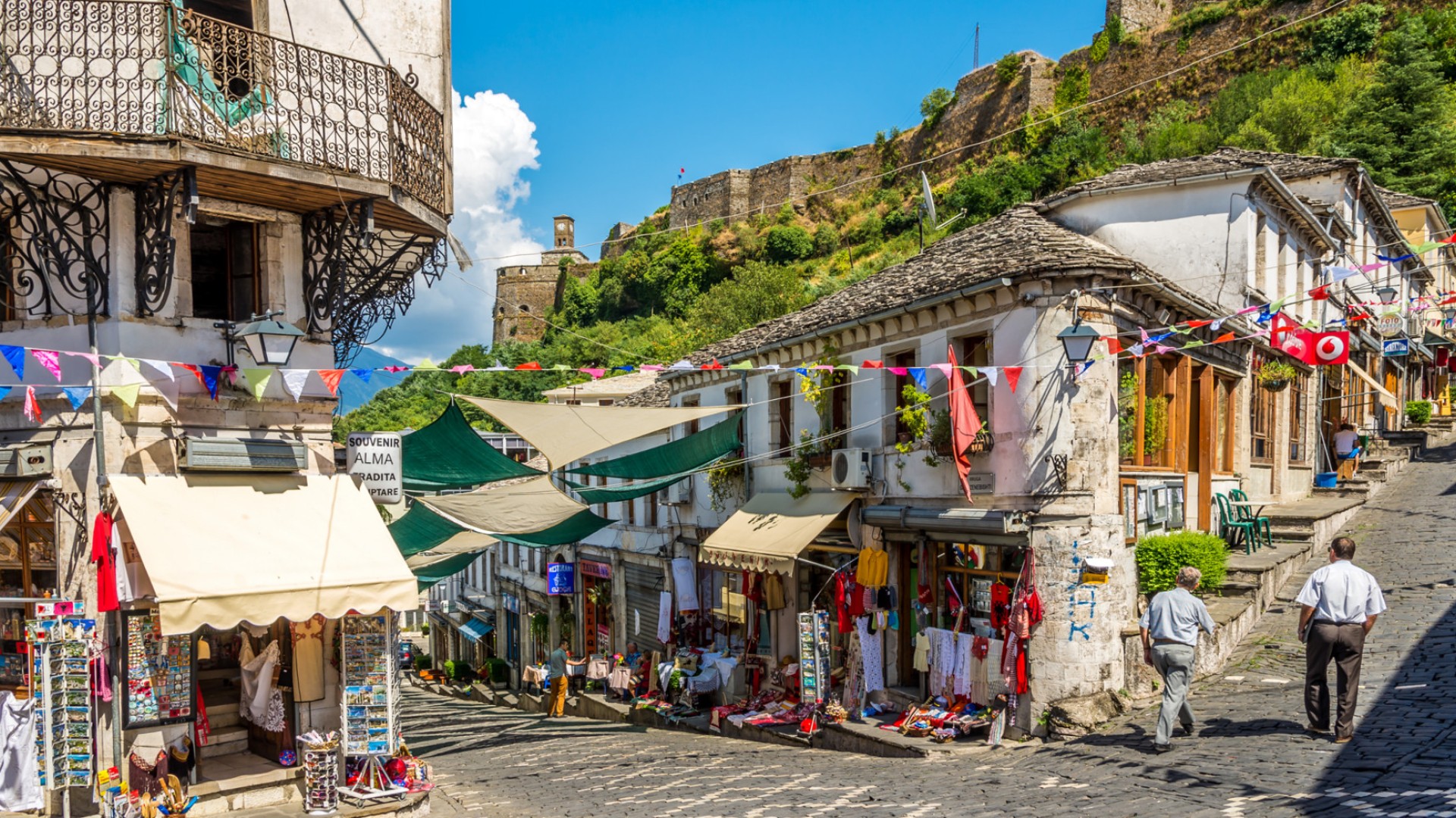 View of the historic Gjirokaster, Albania full of cobblestone roads and buildings on a sunny day