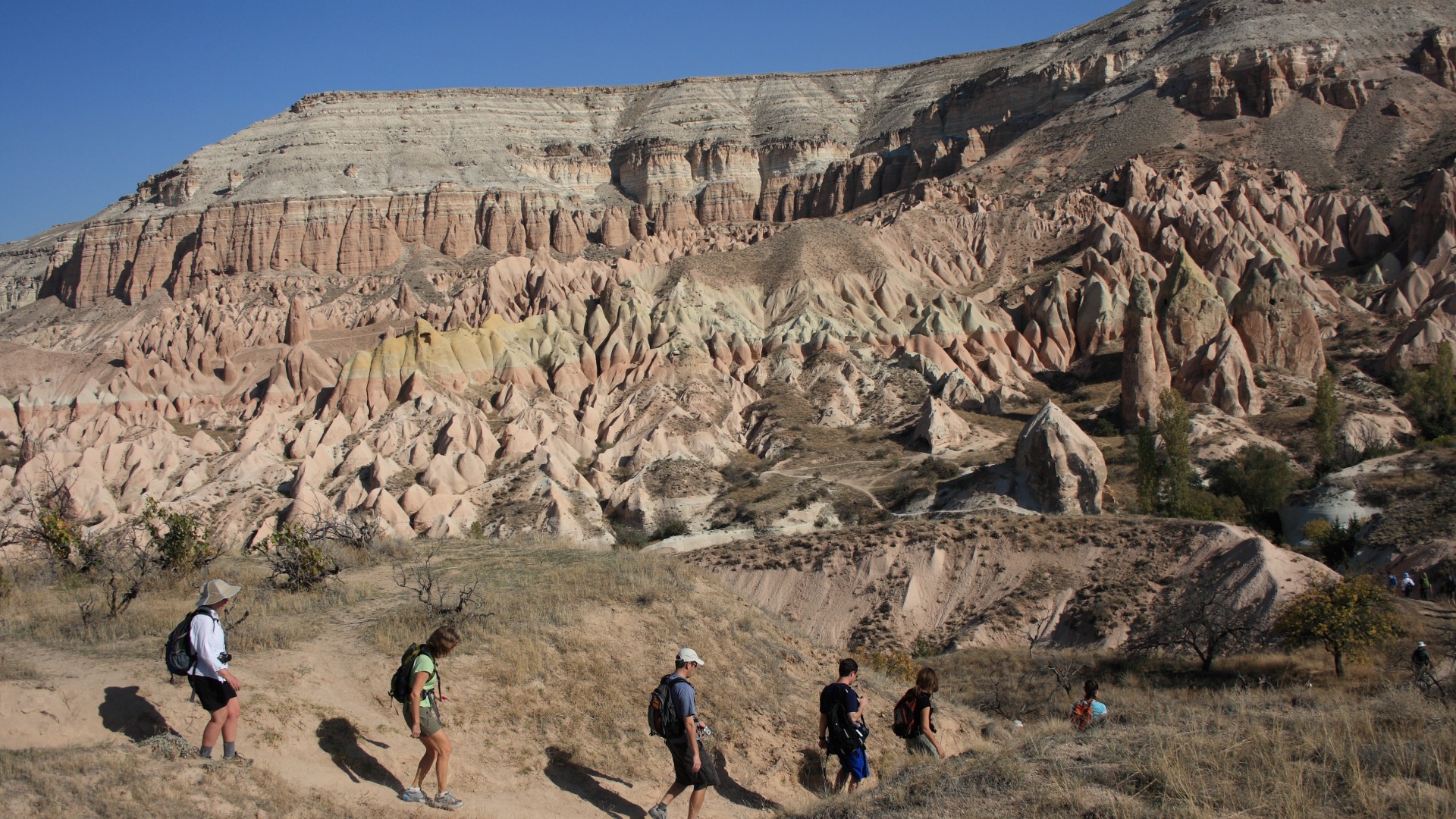 Hikers in the rugged, desert, landscape of Turkey