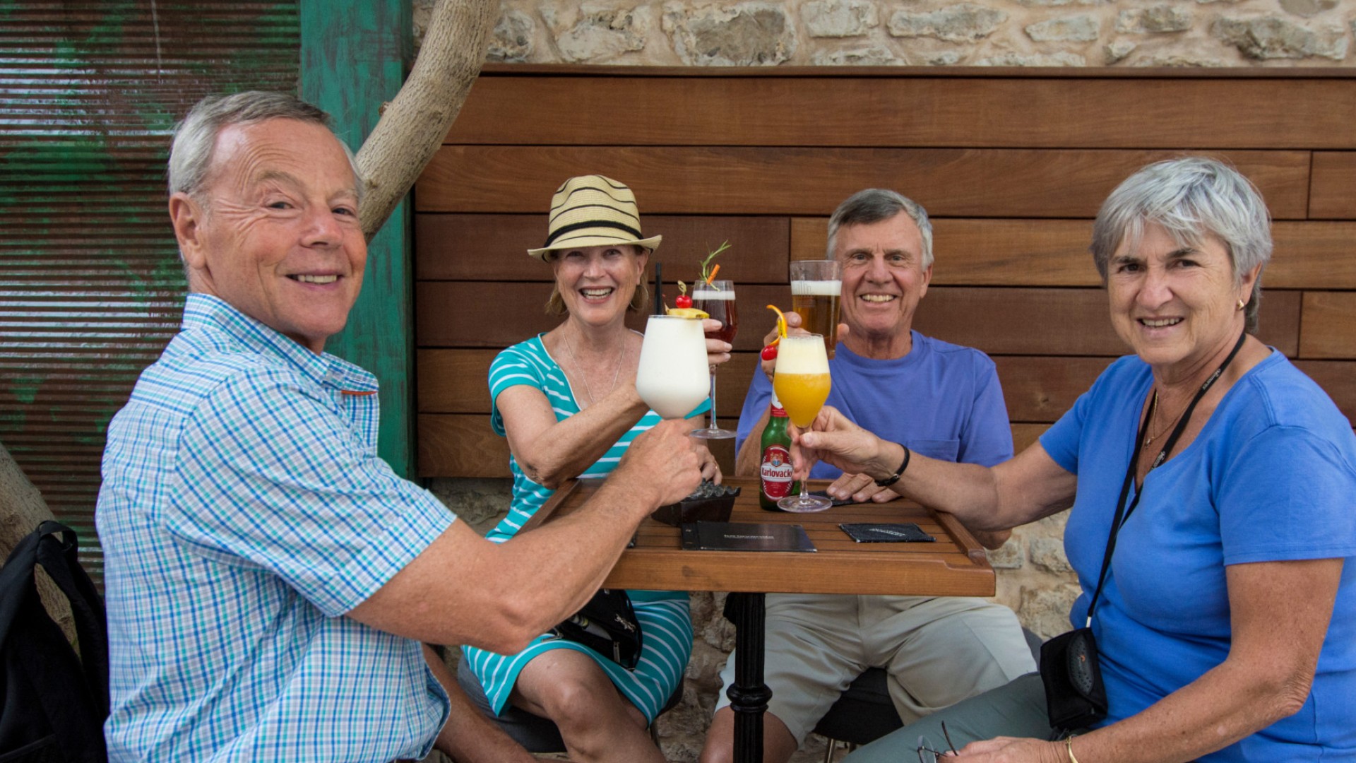 Group of travelers enjoying happy hour drinks in Albania