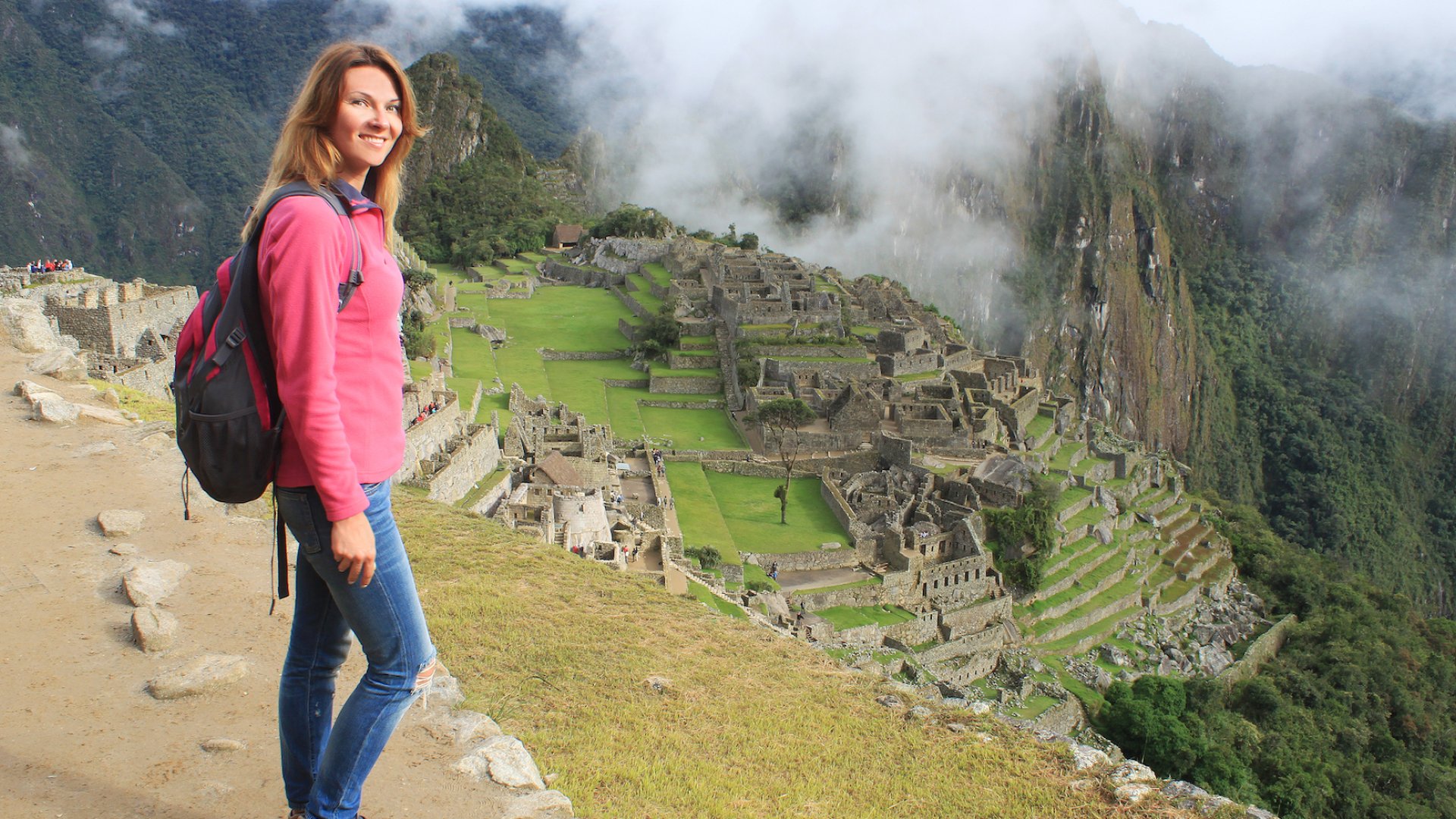 Person smiling while hiking Machu Picchu Peru