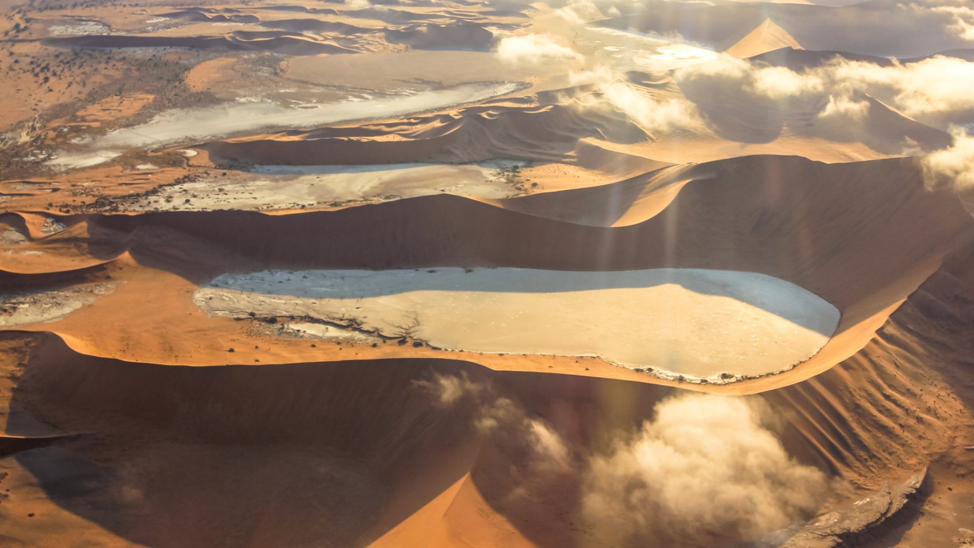 Birds eye view of sand dunes and desert basins in Namib Naukluft National Park in Namibia