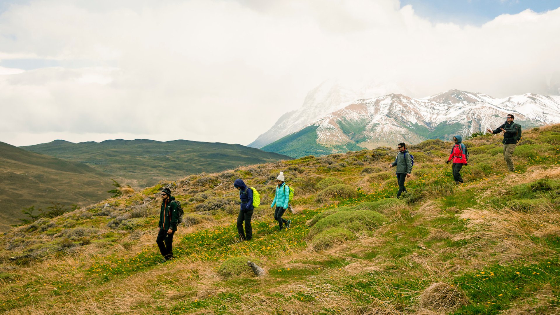People hiking in Patagonia on an immersive guided eco-camp tour