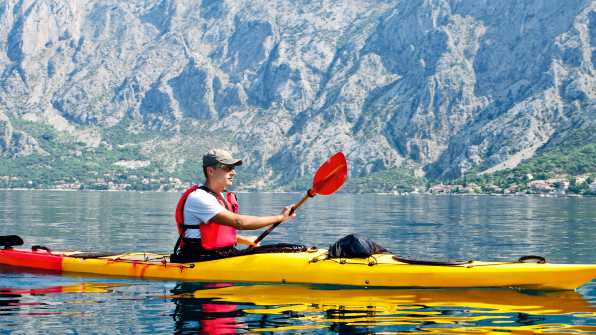 Sea kayakers paddling along the Adriatic Sea through Montenegro