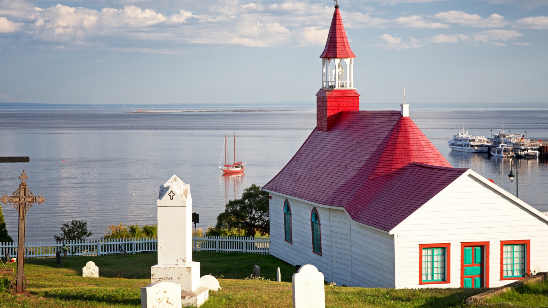 white church with red roof in Tadoussac Quebec