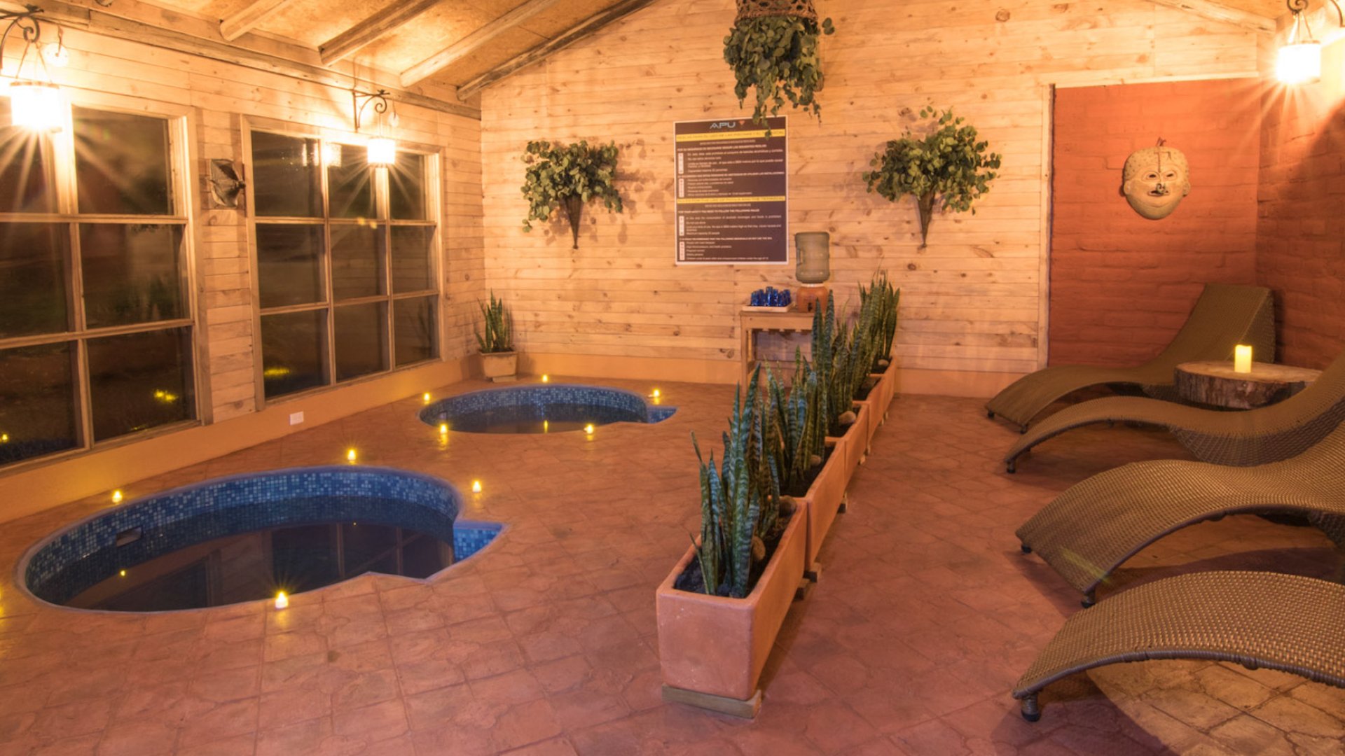 Two hot tubs and lounge chairs at the spa at Tierra de Volcan, Ecuador