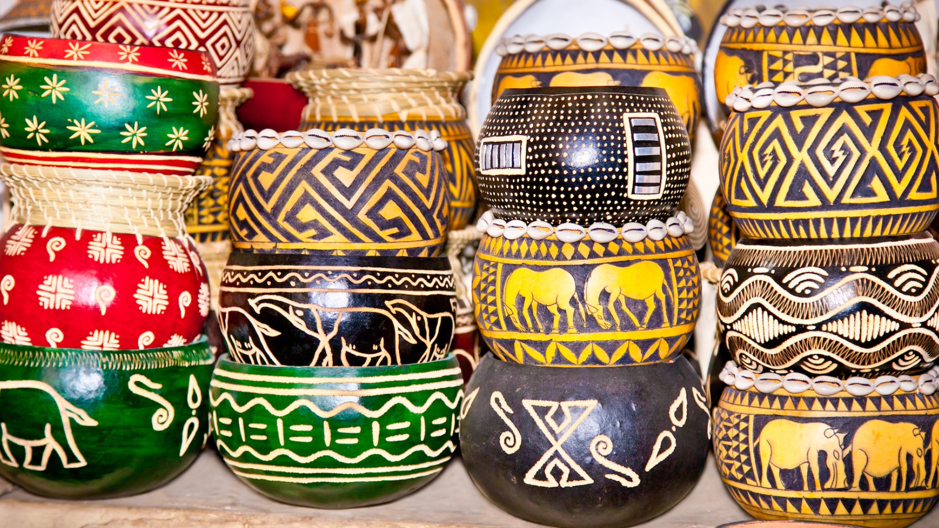 Stacked carved bowls with traditional painting art from Kenya