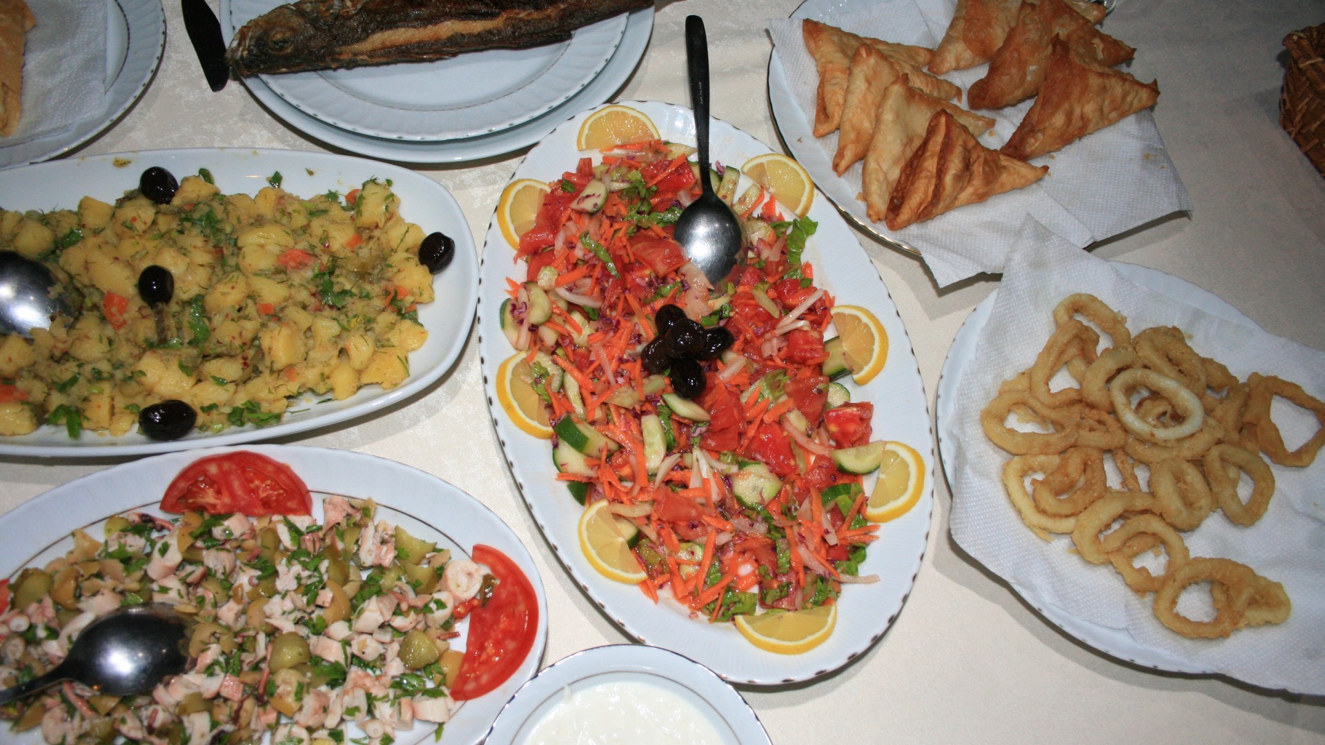 Plates of traditional Turkish food ready to be served to guests aboard a cruise