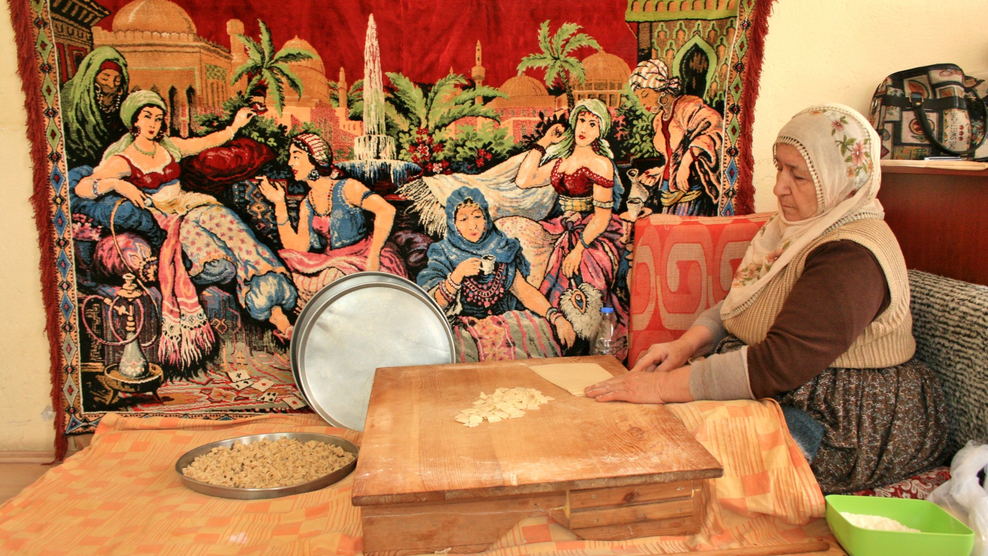 Turkish woman making dough for a traditional Turkish meal 