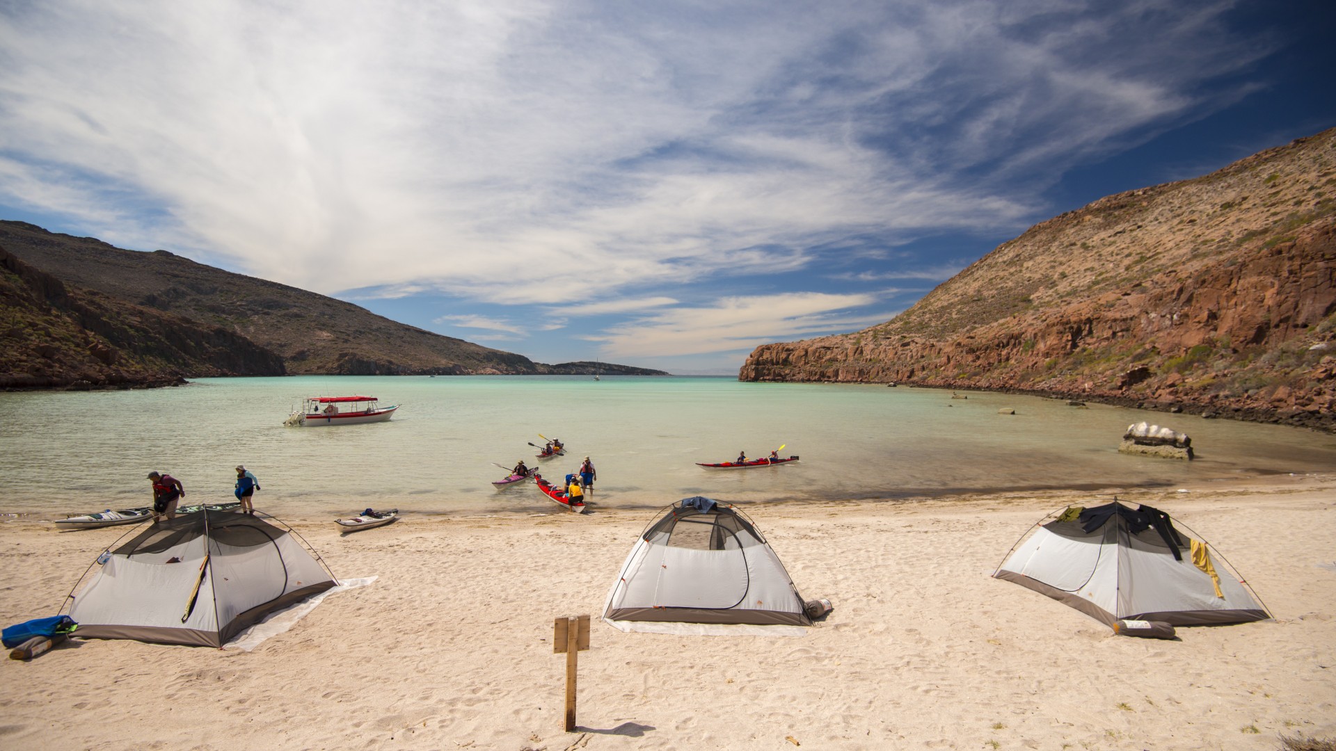 Beach camp set up on a partly cloudy day on a island off the coast of La Paz along the Gulf of California