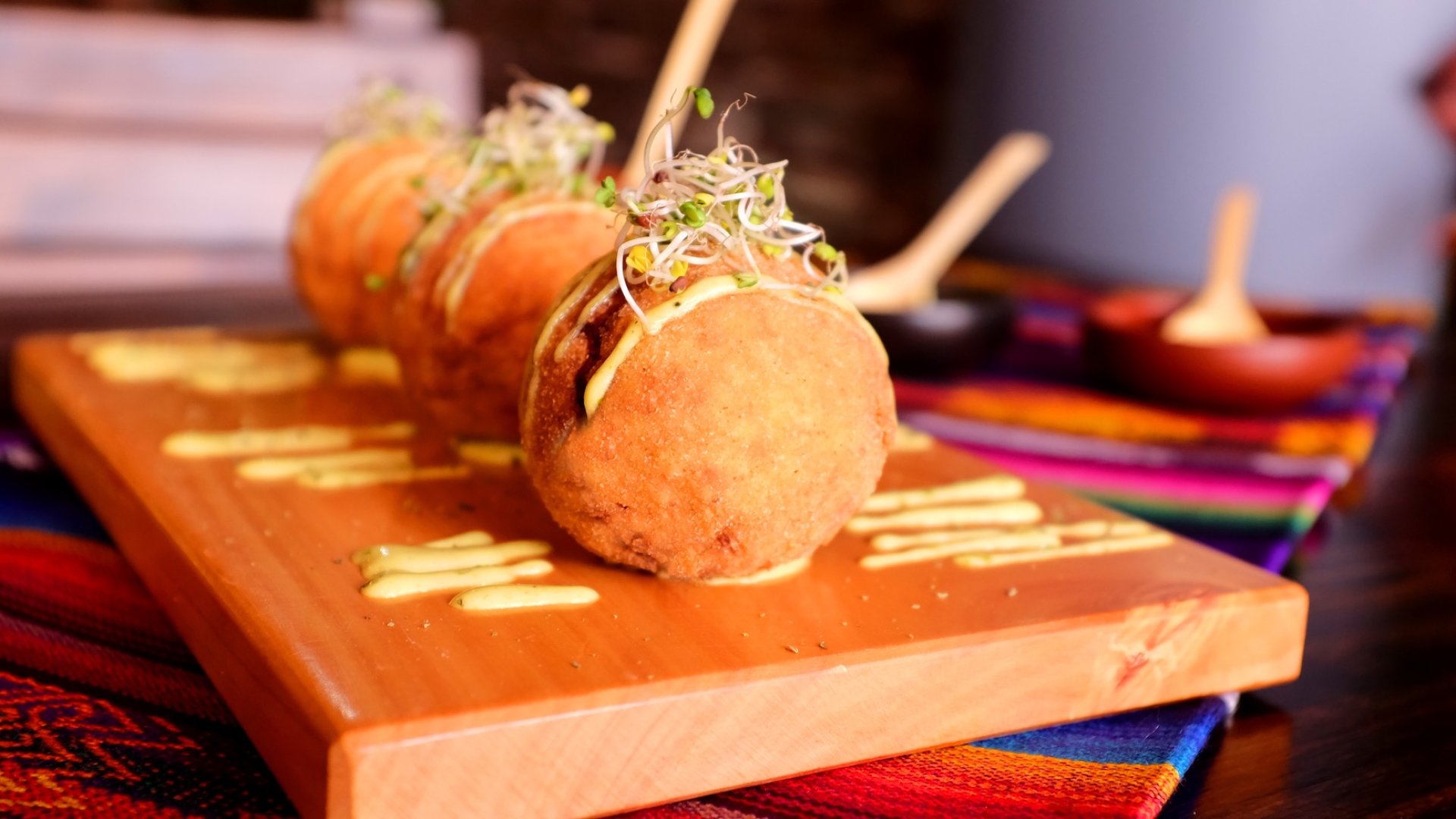 Traditional Peruvian food served on a wooden platter with colorful textiles – culinary travel in Peru