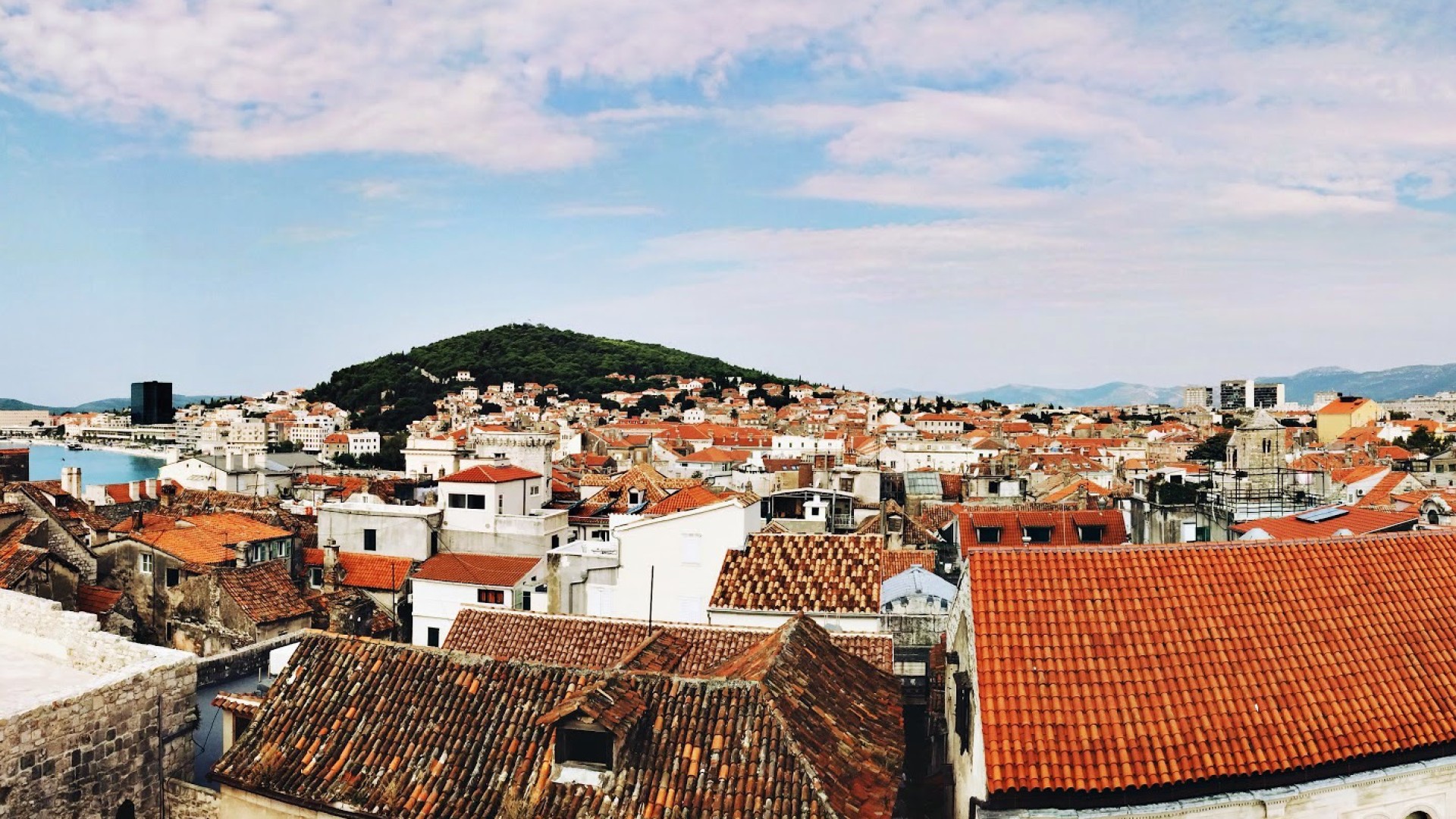 Panoramic view of a traditional Croatian town with white homes with terracotta rooftops 