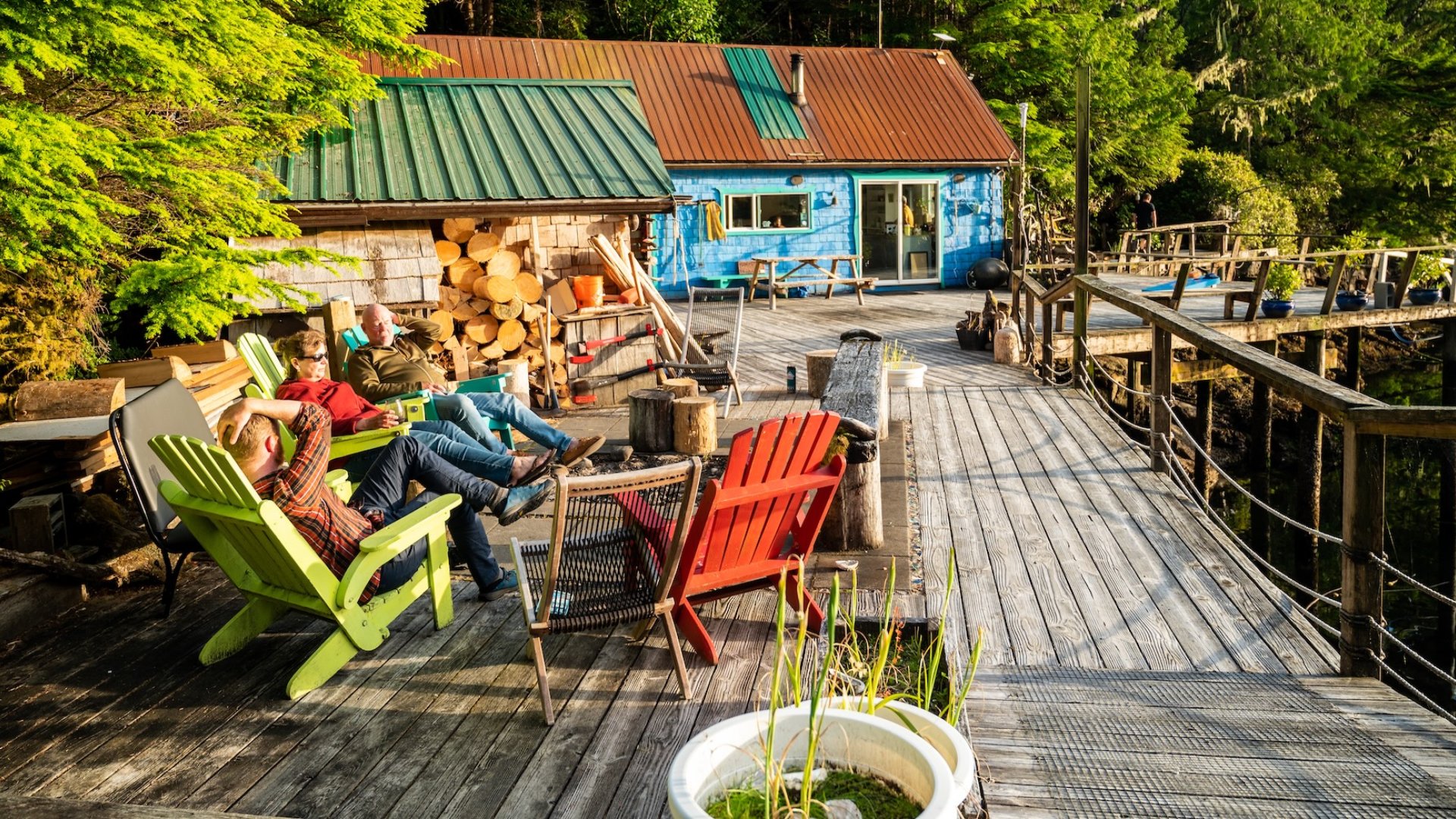 Guests relaxing on the waterfront deck at God’s Pocket Resort in British Columbia