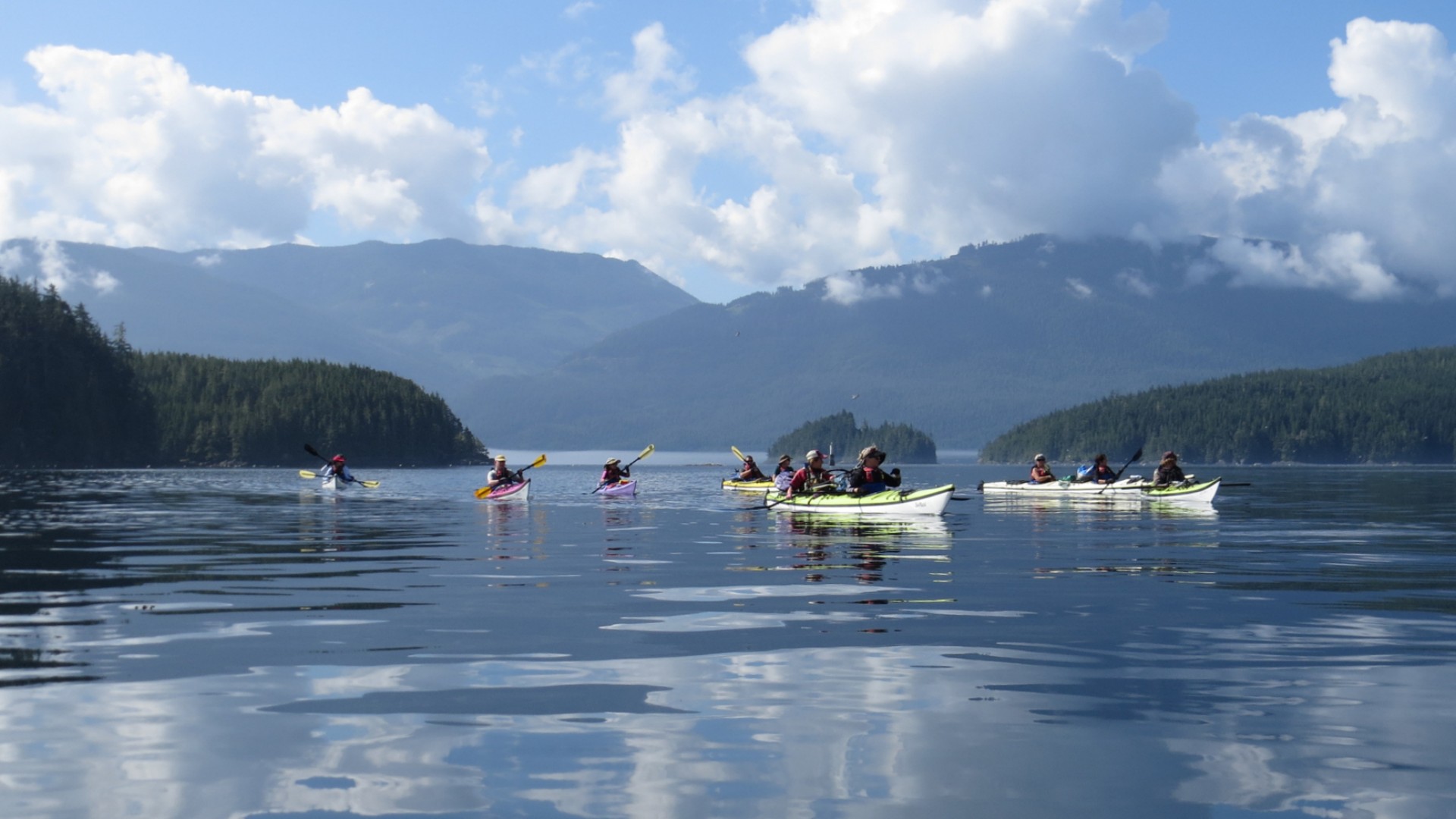 Kayakers paddling off the coast of Vancouver Island near Paddlers Inn