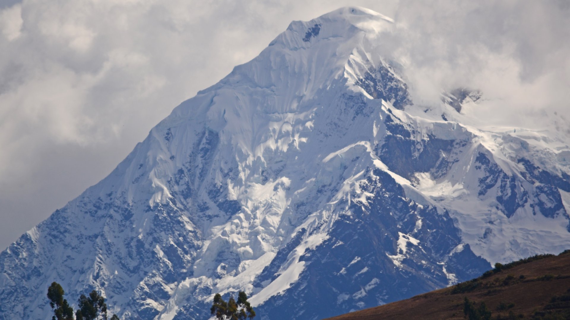 Majestic snow-covered Andes mountain peak in Peru – South America travel and hiking destination