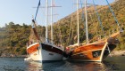 Picture from the water of the bow of two small sail ships used for chartered yachting tours in Turkey