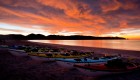 Beach sunset overlooking sea kayaks on the shore off the Sea of Cortezon Carmen Island in Baja California Sur