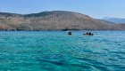 A group of sea kayakers exploring the Albania coastline on a guided tour in Europe.