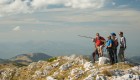 Guests at the top of a peak overlooking Albania and Montenegro in Europe