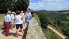 Small group of travelers exploring a scenic French countryside viewpoint during a guided Canal Boat Tour in France.