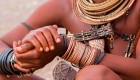 Himba Person covered in traditional jewelry in Namibia