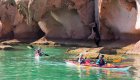 kayaks in front of rock formations along espiritu santo 