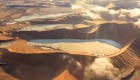Birds eye view of sand dunes and desert basins in Namib Naukluft National Park in Namibia