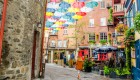 umbrellas hanging above street in quebec