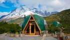 A geodesic dome style tent in front of snowy mountains in Patagonia