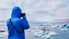 man taking photographs in the arctic