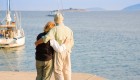 Couple standing on a boating dock with their backs to the camera in Croatia