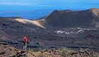 Person standing and observing the Sierra Negra Volcano in the Galapagos