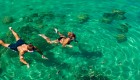 Two people snorkeling in crystal clear water in Croatia
