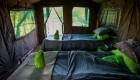The inside of a canvas style tent with two twin beds in Namibia