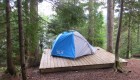 tent on platform in quebec wilderness area