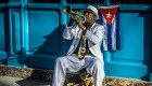 musician playing near cuban flag
