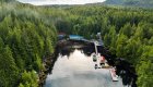 Aerial view of God’s Pocket Resort surrounded by dense forest and calm coastal waters in British Columbia