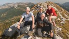 Group of hikers posing at the top of a mountain in Albania 