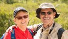 Smiling hikers enjoying a sunny day of hiking on Corsica during a guided adventure tour.