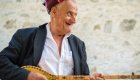 man playing an instrument in albania